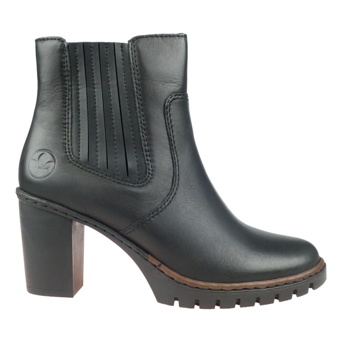 Sivuvaade: tyylikäs tolppakorko ja nahka/synteettinen yhdistelmä.